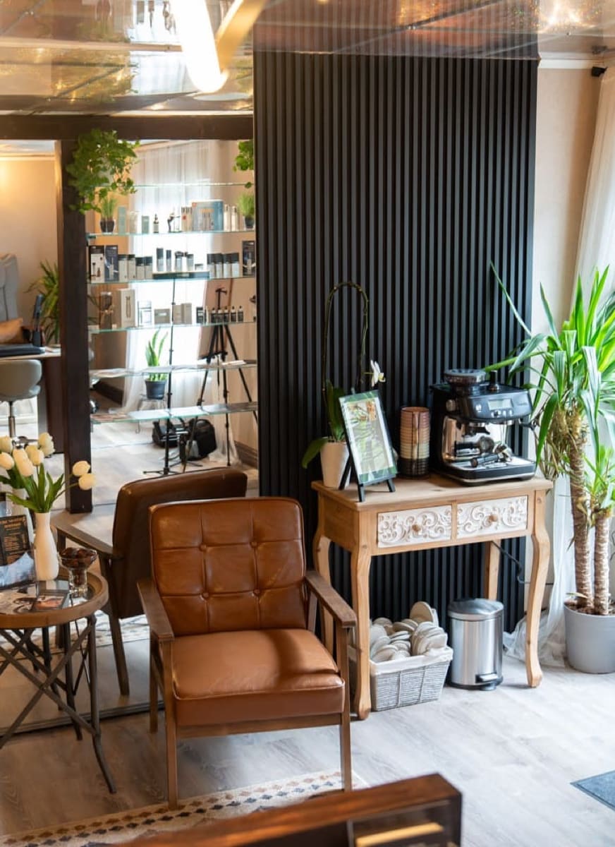 Lounge at Like No Other Boutique in Centennial, Colorado, seen as if through a tall arched window